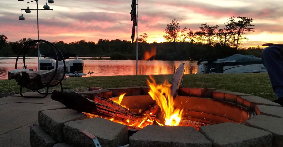 Fire pit at RV resort at sunset